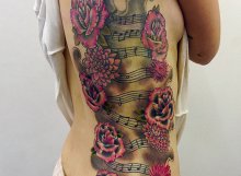 Roses and music notes tattoo
