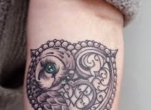 Heart and owl tattoo